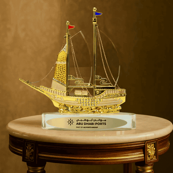 Voyage – Golden Boat Shaped Memento in Metal with Glass Base preview